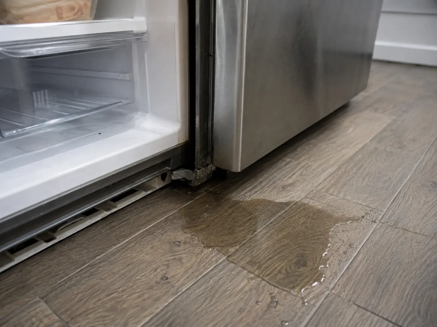 Technical troubleshooting and multimeter testing for Refrigerator Repair showing Water Leaking / Pooling issue