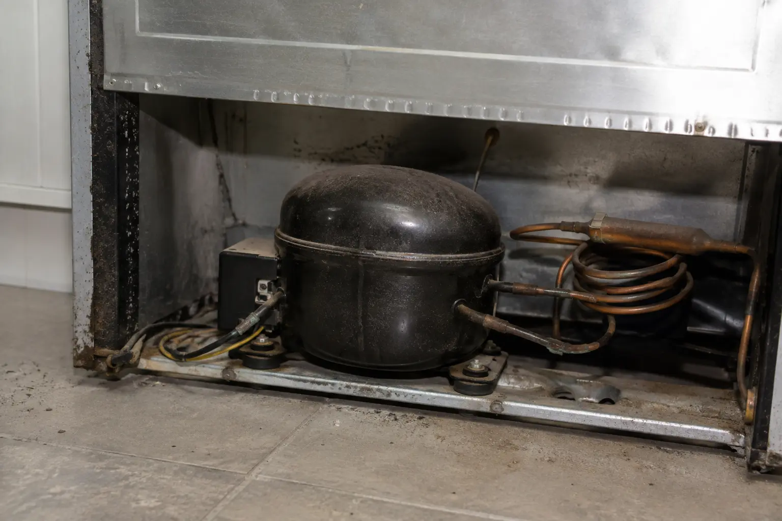 Technical troubleshooting and multimeter testing for Refrigerator Repair showing Making Loud / Grinding Noise issue